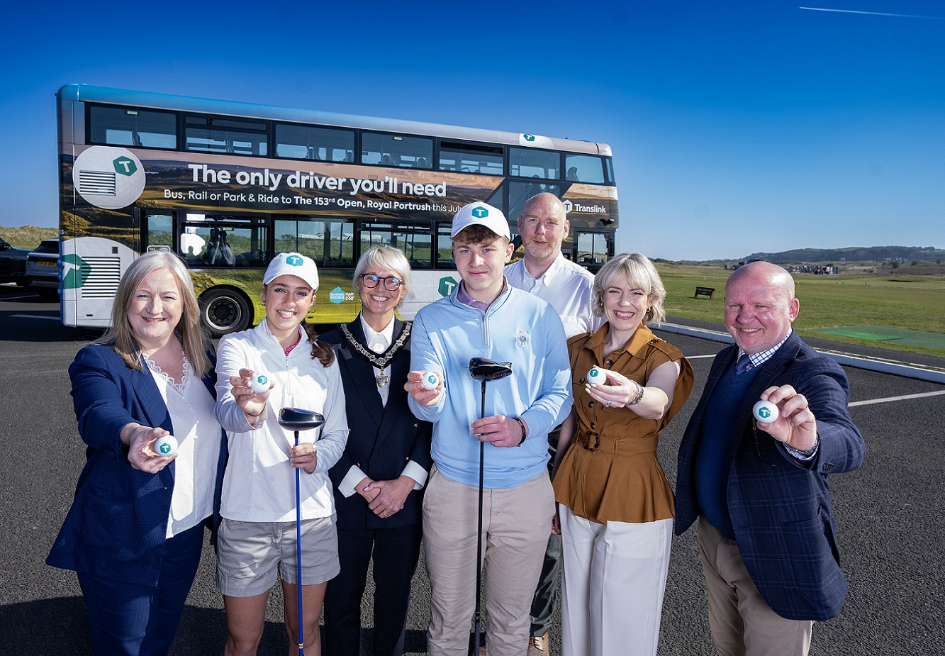 Translink partners at the announcement of travel plans for the 153rd Open holding golf clubs and balls