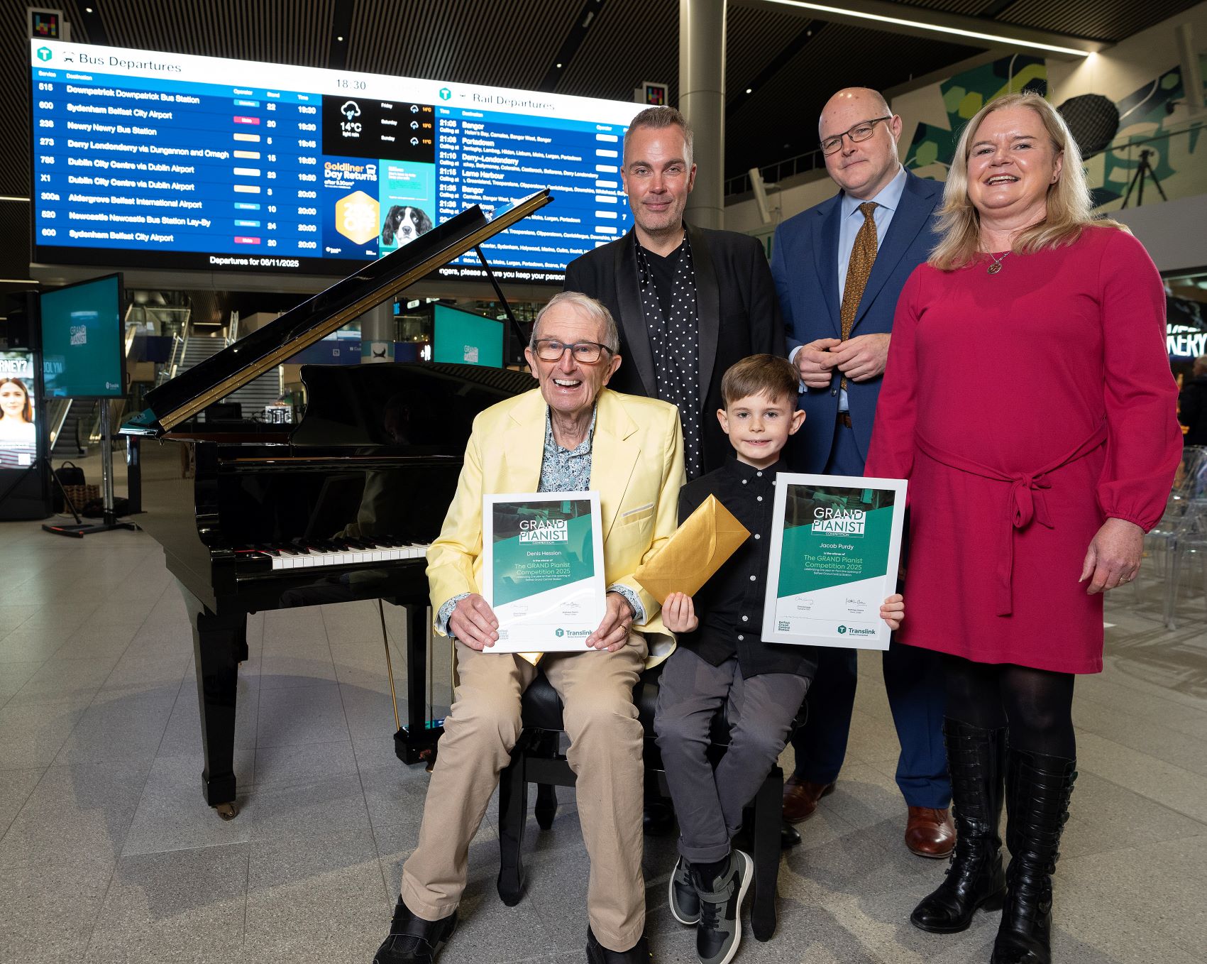 The winners and judges of Translink's Grand Pianist competition in Belfast Grand Central Station
