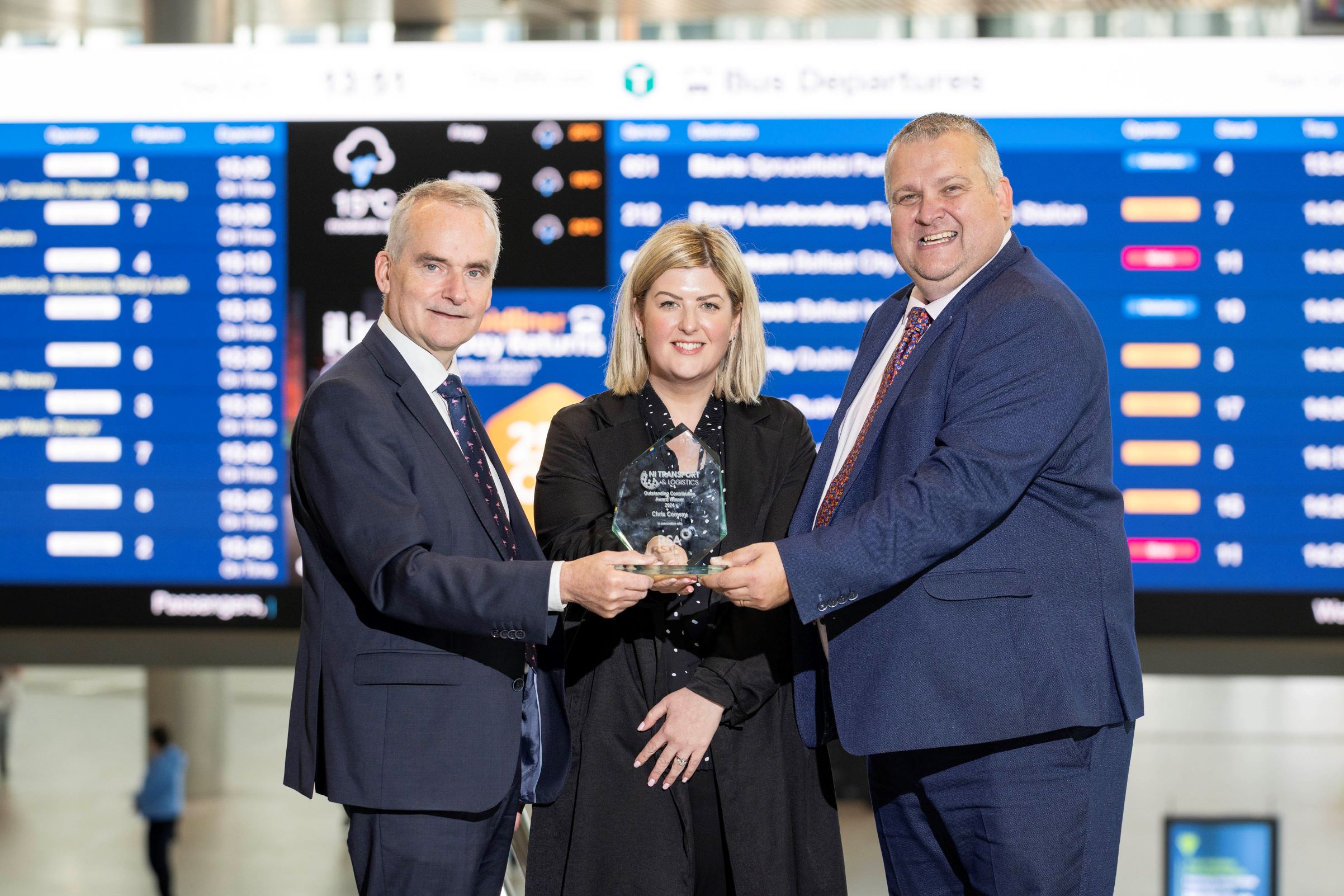 An photo of Translink Group Chief Executive, Chris Conway, receiving the award for outstanding contribution to the transport industry