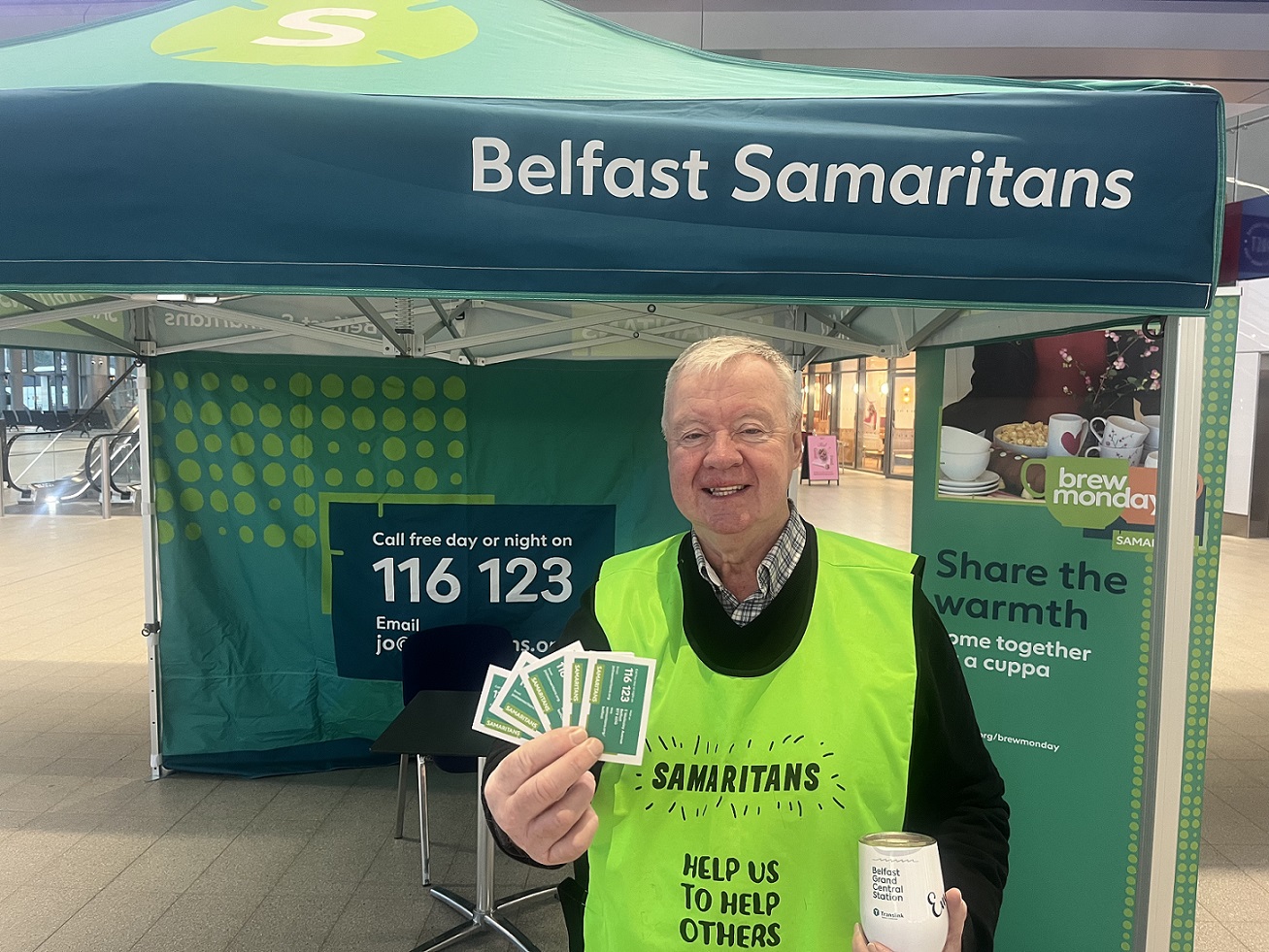 A member of the Samaritans at a stall in Belfast Grand Central Station