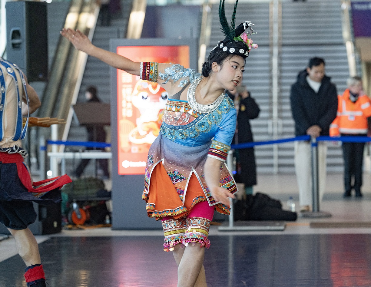 A Chinese dancer taking part in Chinese New Year celebrations at Belfast Grand Central Station