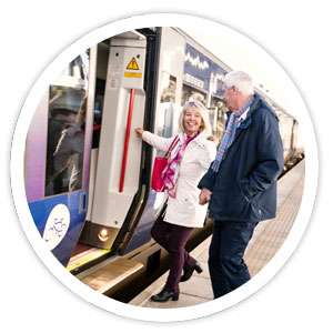 Rail passengers boarding at station