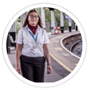 Female rail staff at train platform